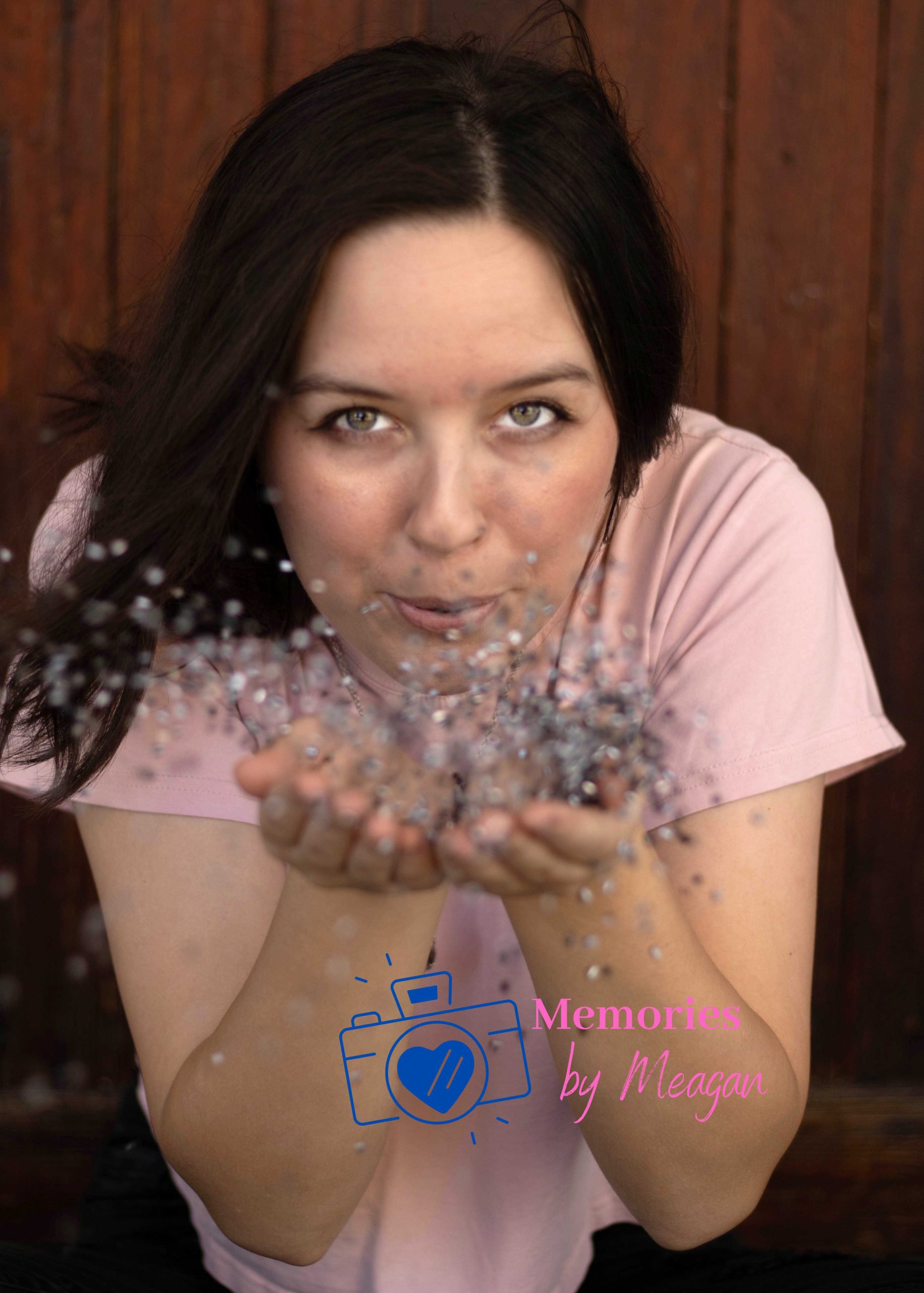 Girl blowing glitter in Kissimmee Florida with Memories By Meagan.