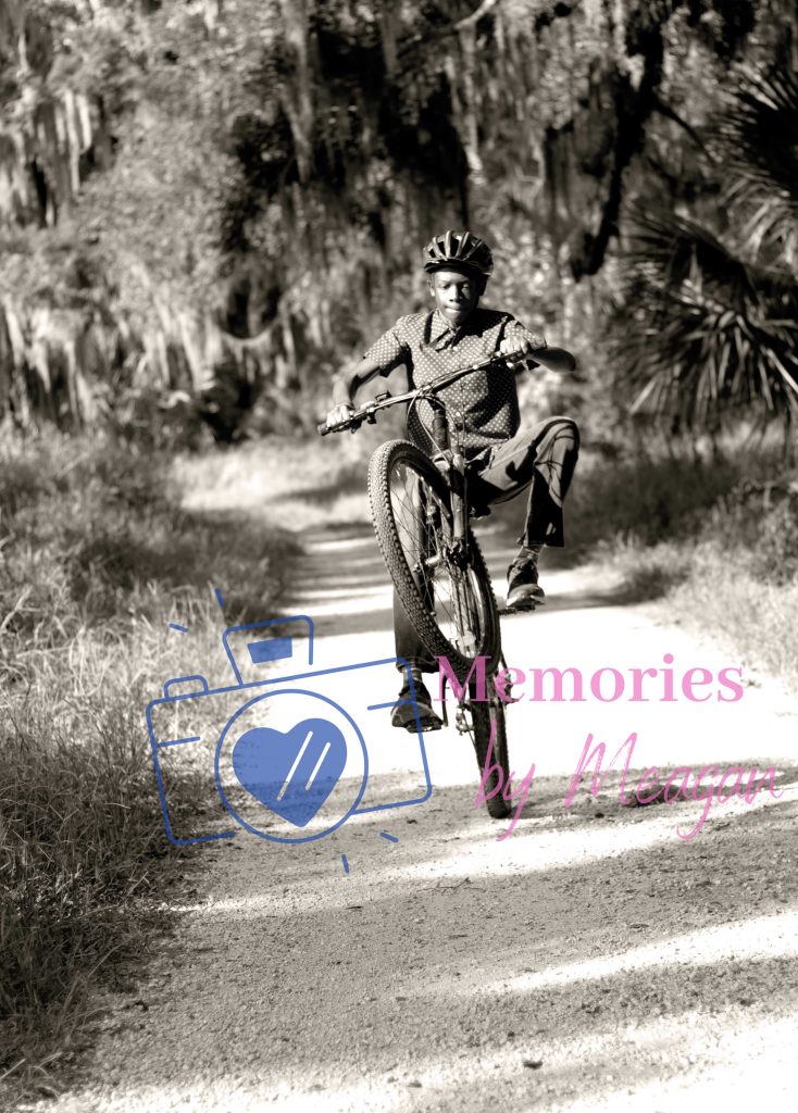 Child on a bike at a Florida nature reserve. 